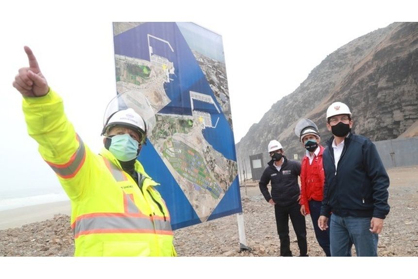 Berg 01 worker stands in front of a map depicting the massive Port of Chancay in Peru