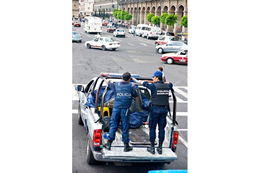 Berg 02 Mexican Police stand guard on the back of a truck in Mexico City